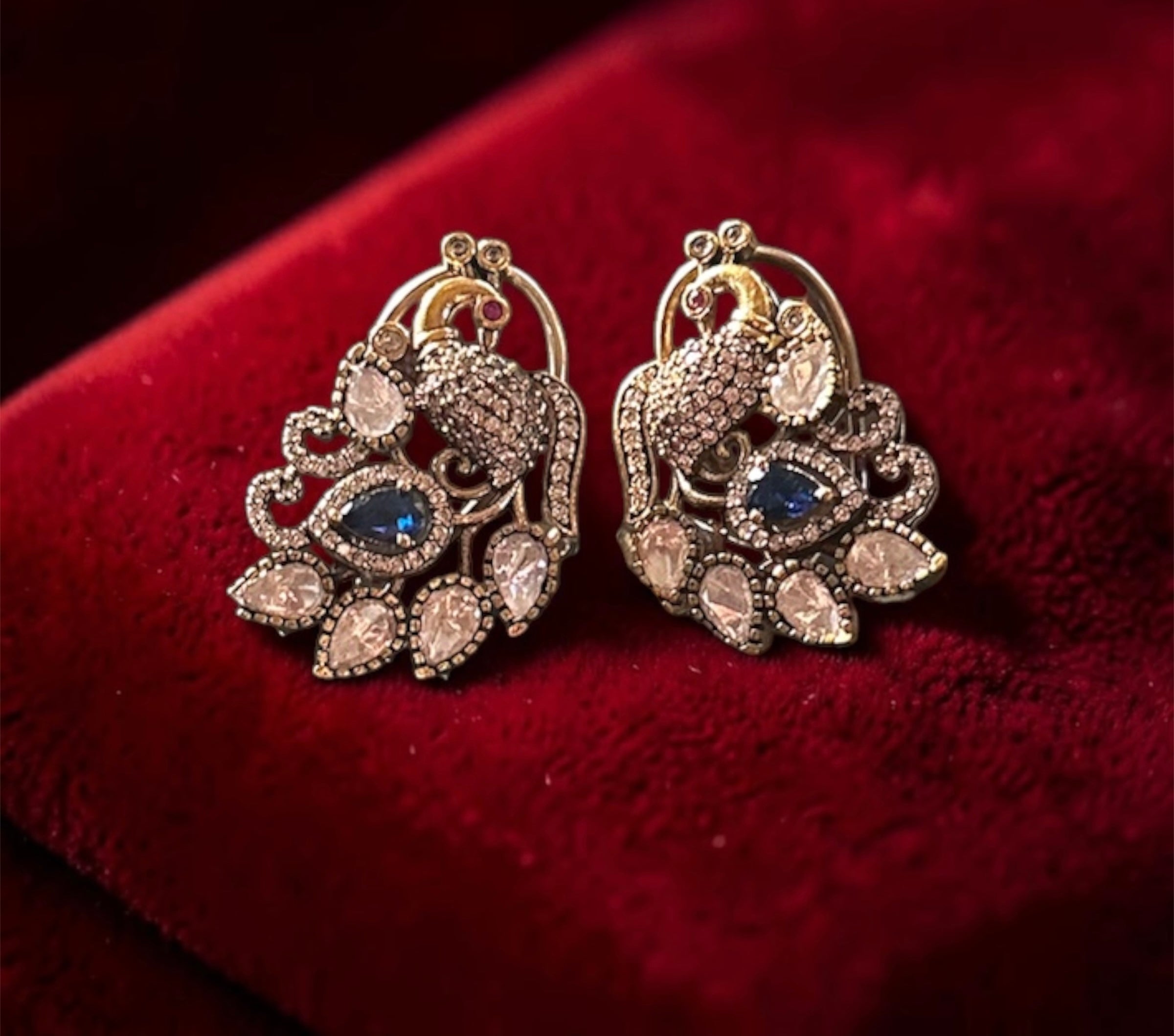 Peacock motif ad studs