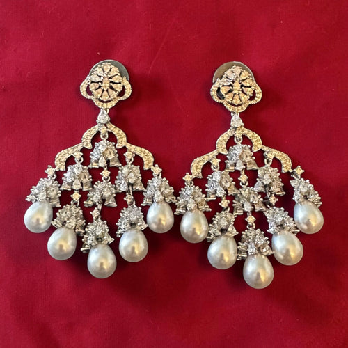 Ad earrings with pearl drops
