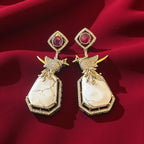 Bird motif ruby n white stone earrings